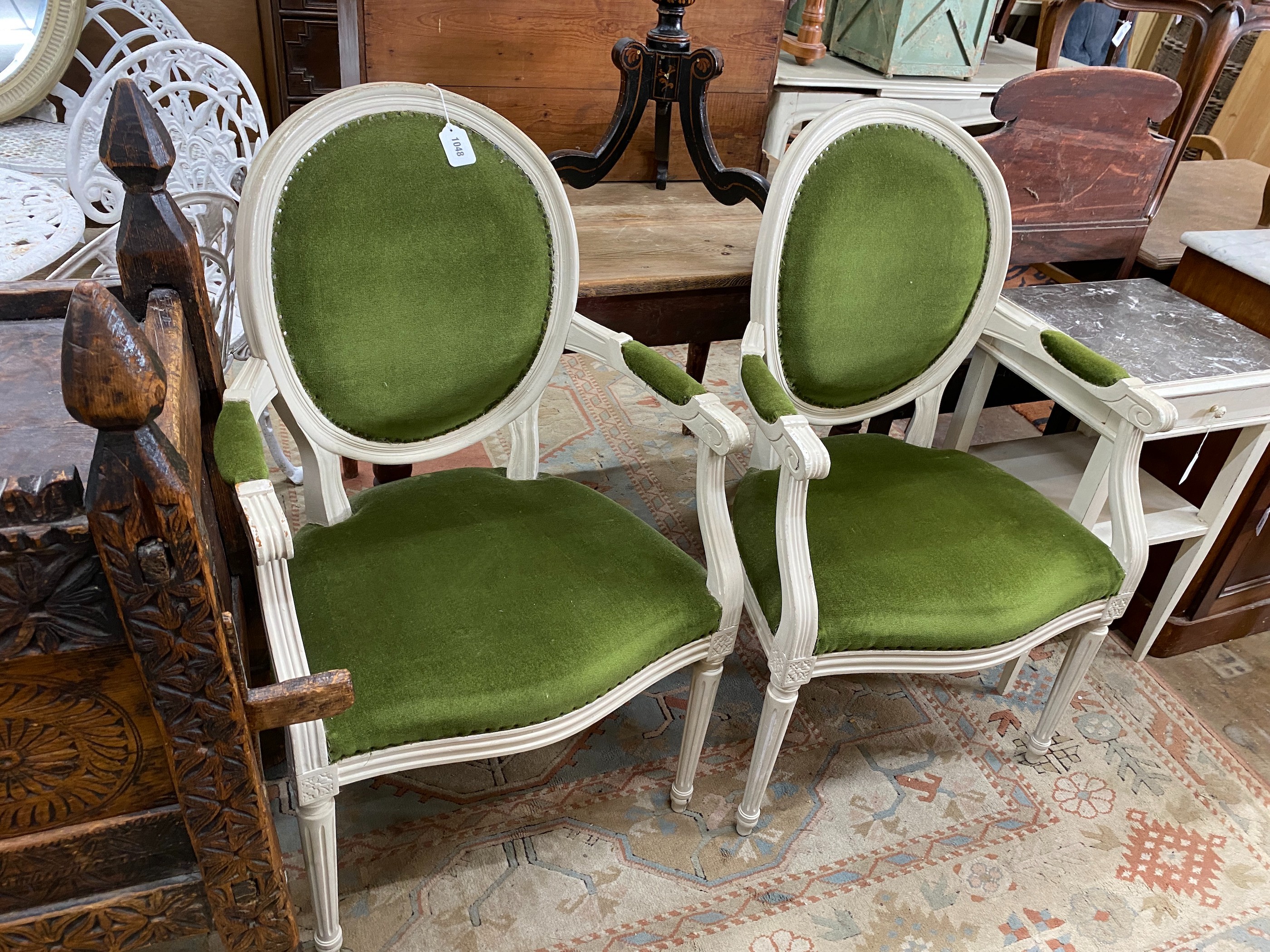 A pair of painted French style elbow chairs, width 60cm, depth 44cm, height 100cm